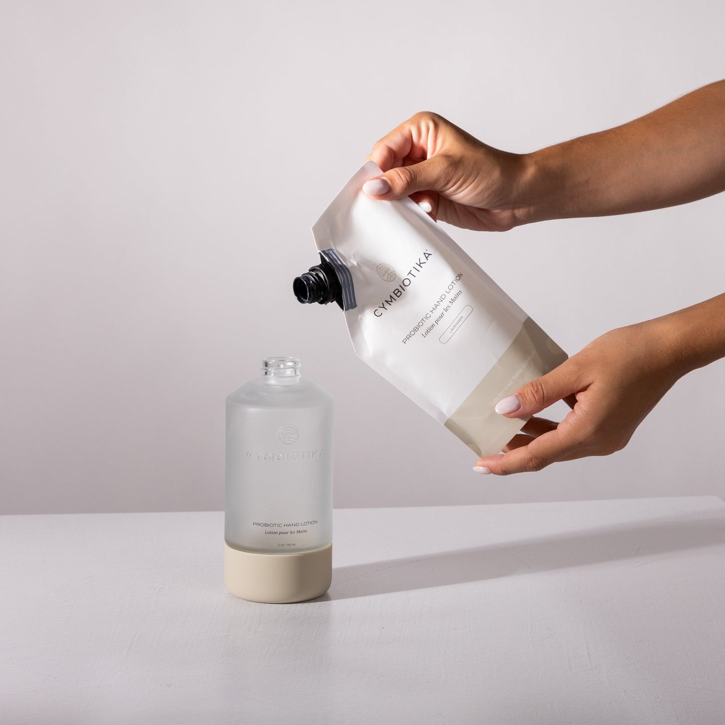 Probiotic Hand Lotion Bottle Being Refilled